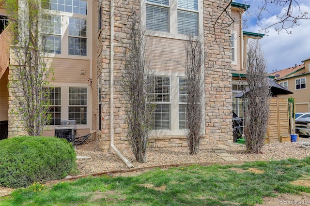 3993 S Dillon Way Unit 104, Aurora, CO 80014 - view of side of property with stone siding