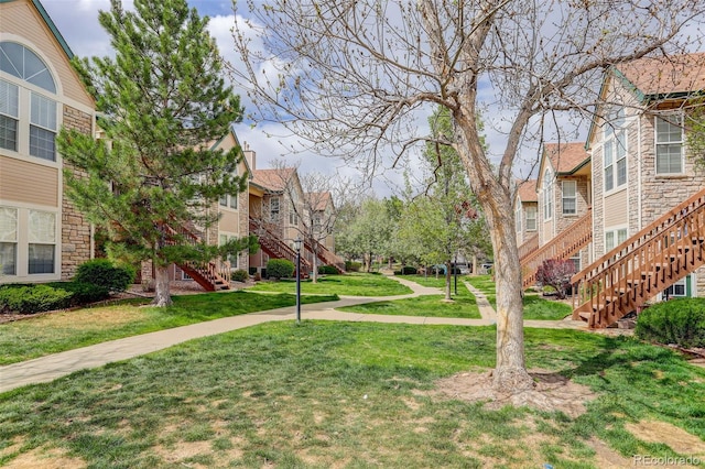 3993 S Dillon Way Unit 104, Aurora, CO 80014 - view of home's community with stairway and a lawn