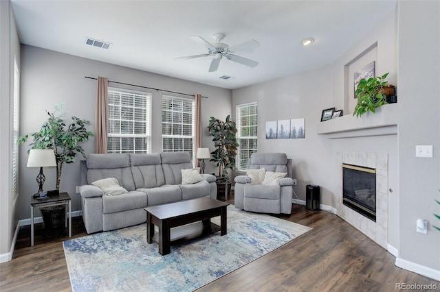 3993 S Dillon Way Unit 104, Aurora, CO 80014 - living room with ceiling fan, baseboards, dark wood finished floors, and a tiled fireplace