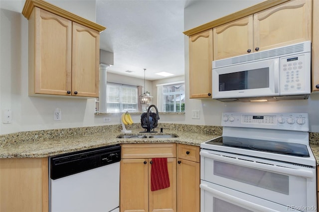 3993 S Dillon Way Unit 104, Aurora, CO 80014 - kitchen featuring white appliances, a sink, and light brown cabinetry