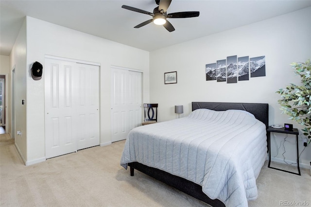 3993 S Dillon Way Unit 104, Aurora, CO 80014 - bedroom featuring multiple closets, light colored carpet, and baseboards