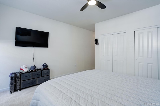 3993 S Dillon Way Unit 104, Aurora, CO 80014 - carpeted bedroom featuring multiple closets, ceiling fan, and baseboards