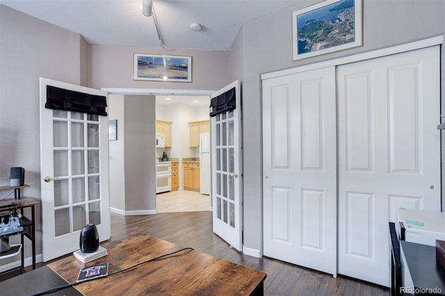 3993 S Dillon Way Unit 104, Aurora, CO 80014 - office space featuring french doors, dark wood finished floors, and baseboards