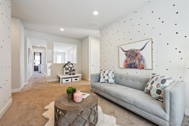 living room featuring light colored carpet, visible vents, baseboards, and recessed lighting