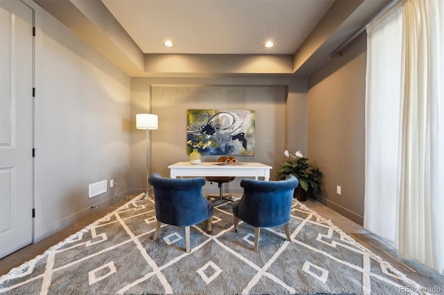 living area with recessed lighting, visible vents, and baseboards