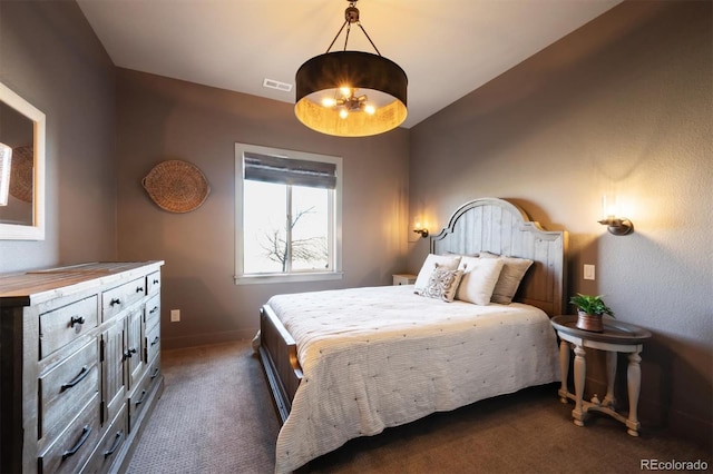 bedroom featuring dark carpet, visible vents, and baseboards