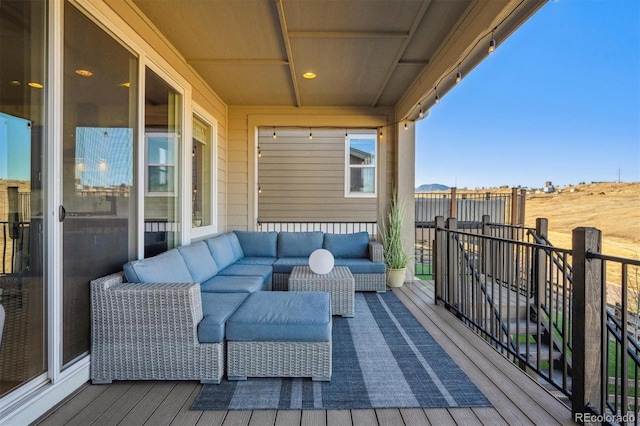 wooden deck with outdoor lounge area