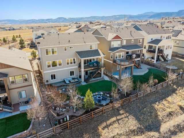 birds eye view of property featuring a mountain view and a residential view