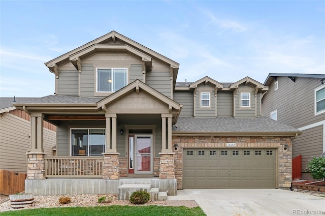 16685 E 101st Ave, Commerce City, CO 80022 - craftsman inspired home with a shingled roof, an attached garage, stone siding, a porch, and concrete driveway