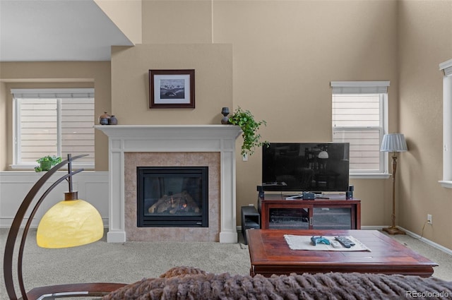 16685 E 101st Ave, Commerce City, CO 80022 - living room featuring baseboards, carpet flooring, and a fireplace