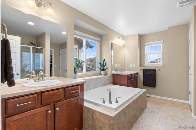 16685 E 101st Ave, Commerce City, CO 80022 - full bathroom featuring visible vents, a shower stall, a sink, and a bath