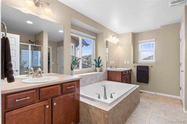 16685 E 101st Ave, Commerce City, CO 80022 - full bathroom featuring visible vents, a shower stall, a sink, and a bath