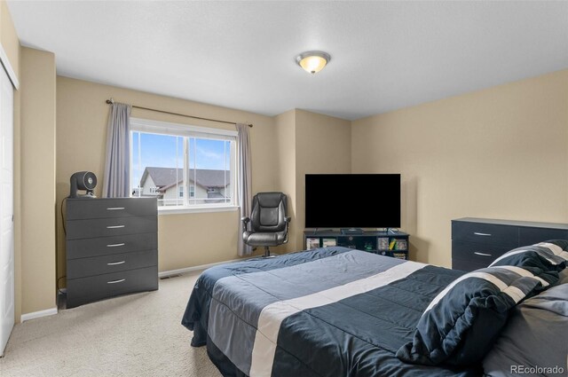 16685 E 101st Ave, Commerce City, CO 80022 - bedroom with baseboards and light carpet
