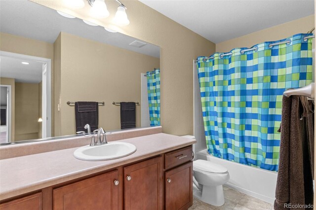 16685 E 101st Ave, Commerce City, CO 80022 - full bath with toilet, tile patterned floors, shower / tub combo with curtain, and vanity