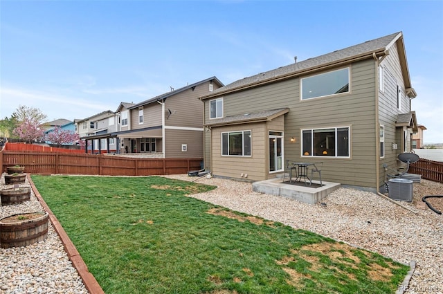 16685 E 101st Ave, Commerce City, CO 80022 - rear view of property featuring a residential view, a fenced backyard, central AC unit, a patio, and a yard