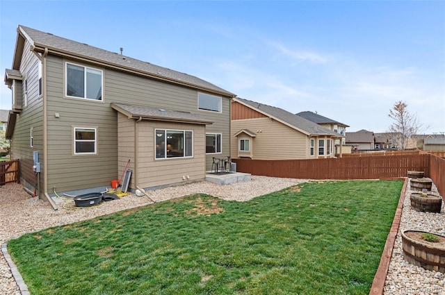 16685 E 101st Ave, Commerce City, CO 80022 - rear view of property with a fenced backyard and a yard