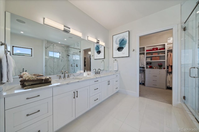 5254 Creation Rock Trl, Morrison, CO 80465 - bathroom with a sink, a walk in closet, and a marble finish shower