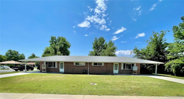 9600 W 18th Dr Unit 9610, Lakewood, CO 80215 - single story home featuring an attached carport, driveway, and brick siding