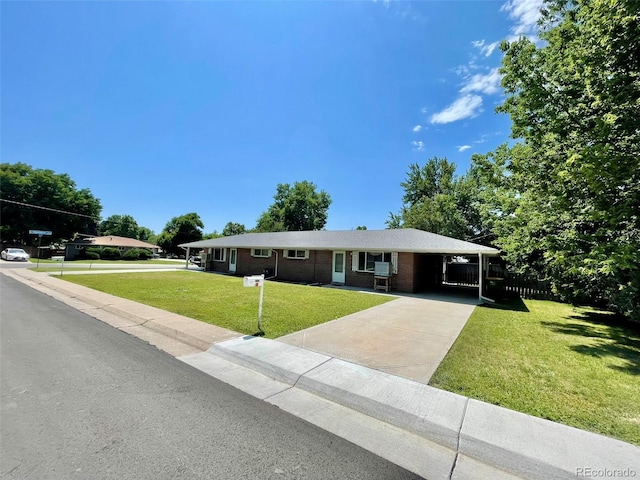9600 W 18th Dr Unit 9610, Lakewood, CO 80215 - ranch-style home featuring a front yard, concrete driveway, a carport, and brick siding