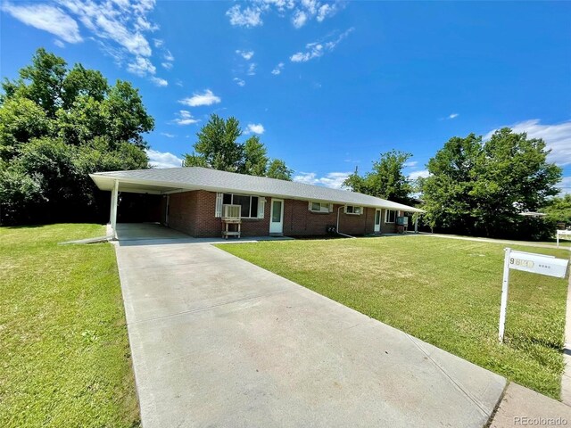 9600 W 18th Dr Unit 9610, Lakewood, CO 80215 - ranch-style house with concrete driveway, a front lawn, brick siding, and a carport
