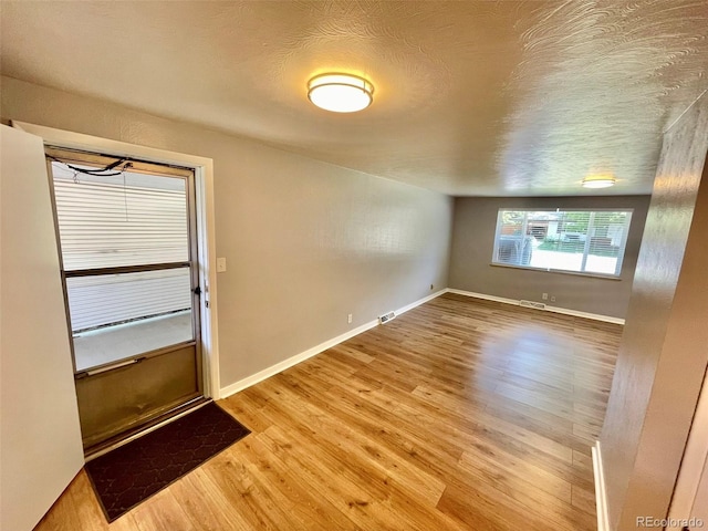 9600 W 18th Dr Unit 9610, Lakewood, CO 80215 - entryway featuring wood finished floors and a textured ceiling