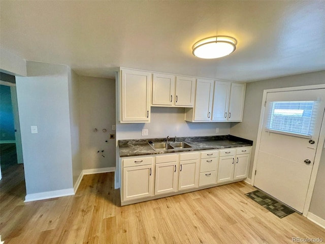9600 W 18th Dr Unit 9610, Lakewood, CO 80215 - kitchen with light wood-style flooring, dark countertops, and white cabinets