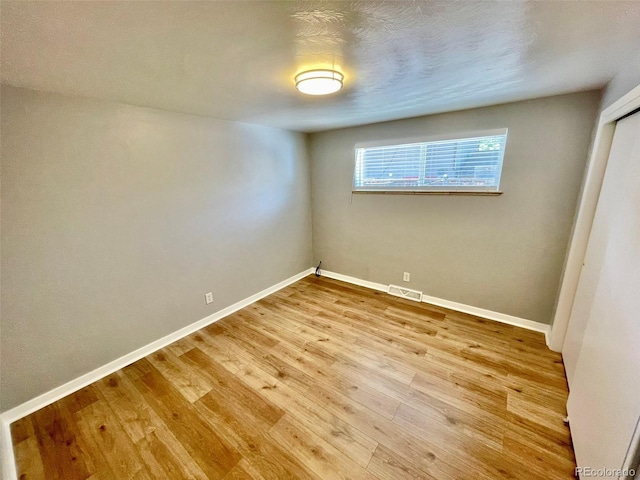 9600 W 18th Dr Unit 9610, Lakewood, CO 80215 - unfurnished room with baseboards and wood finished floors
