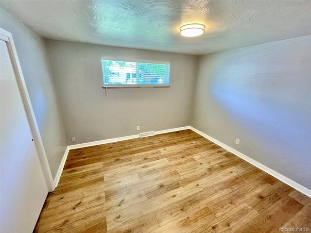 9600 W 18th Dr Unit 9610, Lakewood, CO 80215 - spare room with wood finished floors