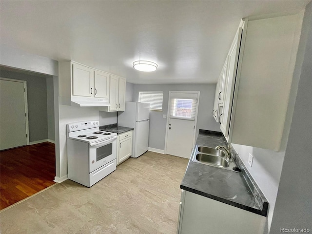 9600 W 18th Dr Unit 9610, Lakewood, CO 80215 - kitchen featuring white appliances, under cabinet range hood, white cabinets, and dark countertops