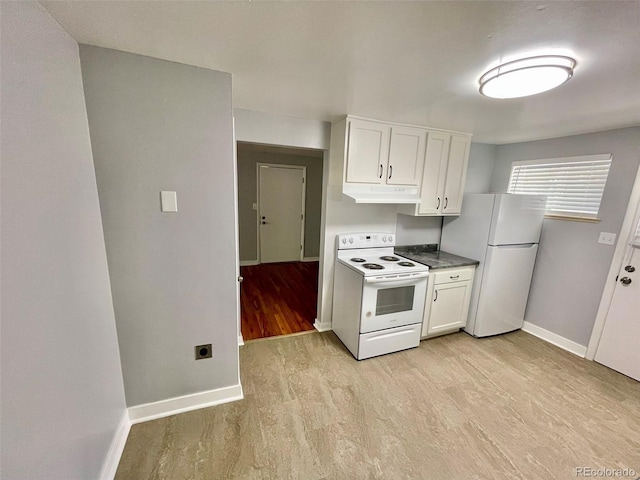 9600 W 18th Dr Unit 9610, Lakewood, CO 80215 - kitchen featuring white appliances, under cabinet range hood, light wood-type flooring, and white cabinetry