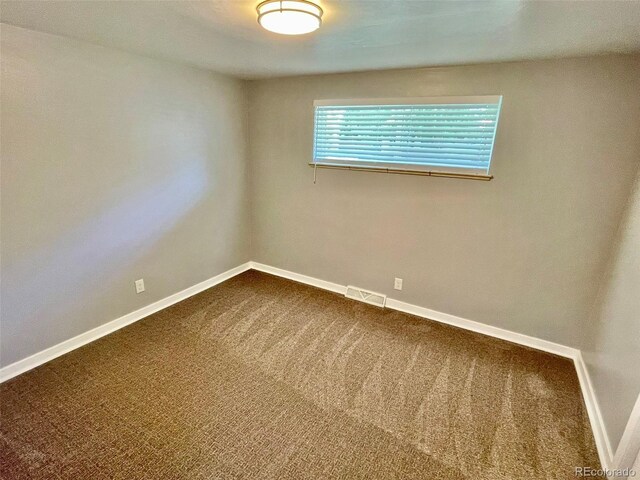 9600 W 18th Dr Unit 9610, Lakewood, CO 80215 - empty room with dark colored carpet and baseboards