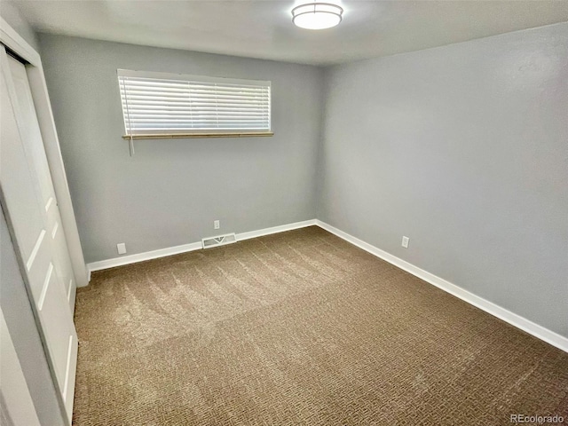 9600 W 18th Dr Unit 9610, Lakewood, CO 80215 - unfurnished bedroom featuring a closet and dark colored carpet