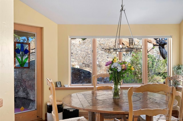 2611 Fox Acres Dr E, Red Feather Lakes, CO 80545 - dining area with plenty of natural light and a chandelier