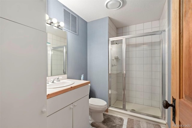 2611 Fox Acres Dr E, Red Feather Lakes, CO 80545 - full bathroom with a shower stall, vanity, toilet, tile patterned floors, and wallpapered walls
