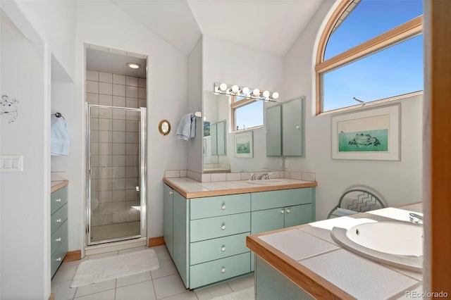 2611 Fox Acres Dr E, Red Feather Lakes, CO 80545 - bathroom with vanity, vaulted ceiling, a stall shower, and tile patterned flooring
