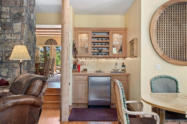 2611 Fox Acres Dr E, Red Feather Lakes, CO 80545 - indoor wet bar with stainless steel fridge and wood finished floors