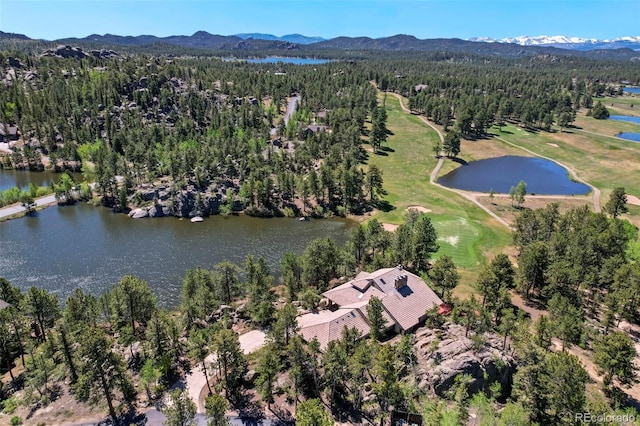 2611 Fox Acres Dr E, Red Feather Lakes, CO 80545 - aerial view of property and surrounding area with a water and mountain view, a golf course, and a heavily wooded area
