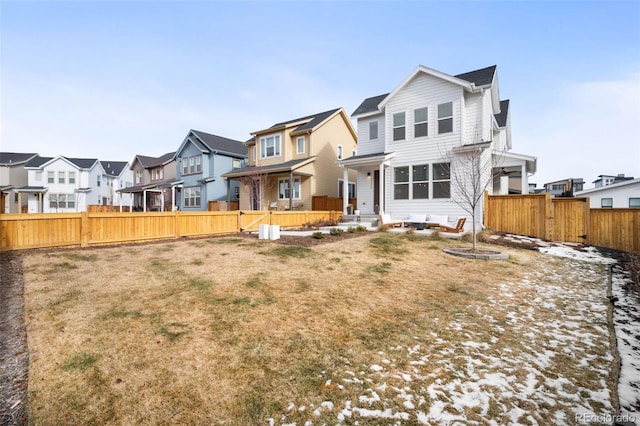 rear view of house with a yard