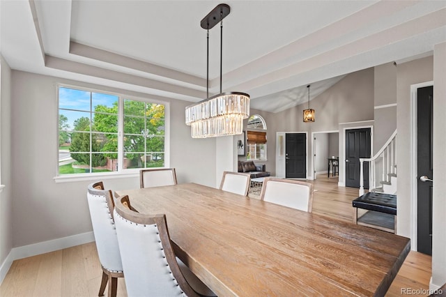 9432 La Quinta Way, Lone Tree, CO 80124 - dining room featuring baseboards, stairs, wood finished floors, and a chandelier