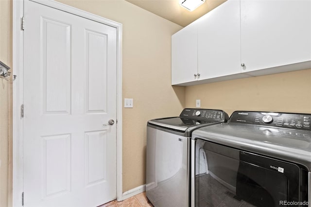 9432 La Quinta Way, Lone Tree, CO 80124 - laundry area featuring cabinet space, washer and clothes dryer, light tile patterned flooring, and baseboards