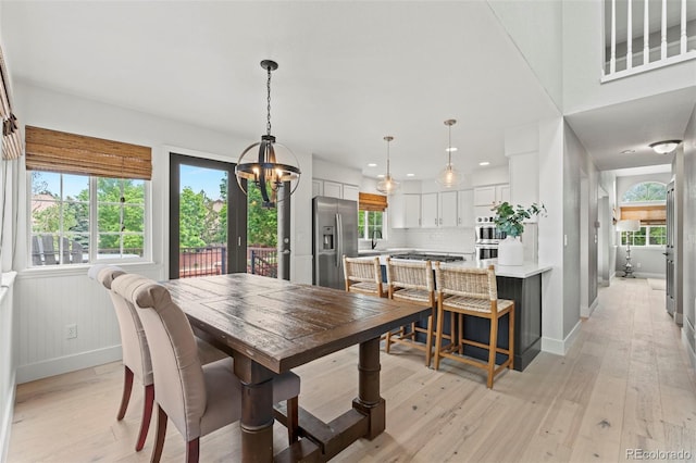 9432 La Quinta Way, Lone Tree, CO 80124 - dining area with a chandelier, light wood-type flooring, and recessed lighting