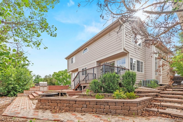 9432 La Quinta Way, Lone Tree, CO 80124 - rear view of house featuring a deck, stairway, and exterior kitchen