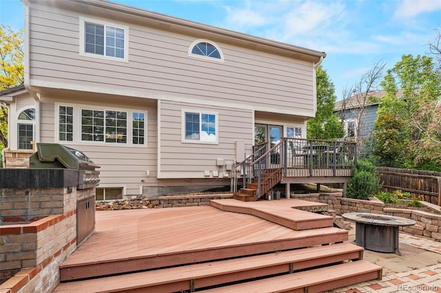 9432 La Quinta Way, Lone Tree, CO 80124 - rear view of house featuring a fire pit, a deck, and stairs