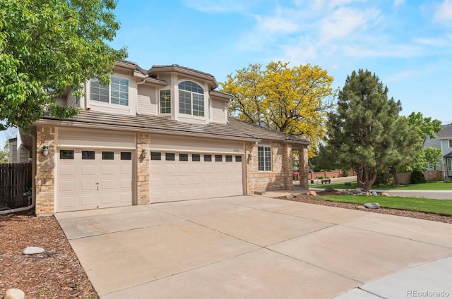 9432 La Quinta Way, Lone Tree, CO 80124 - traditional-style house with a garage, driveway, a tiled roof, and brick siding