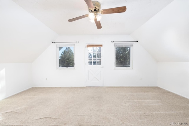 additional living space with carpet, ceiling fan, and vaulted ceiling