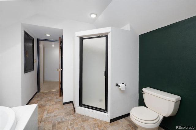 bathroom featuring an enclosed shower, toilet, and vaulted ceiling