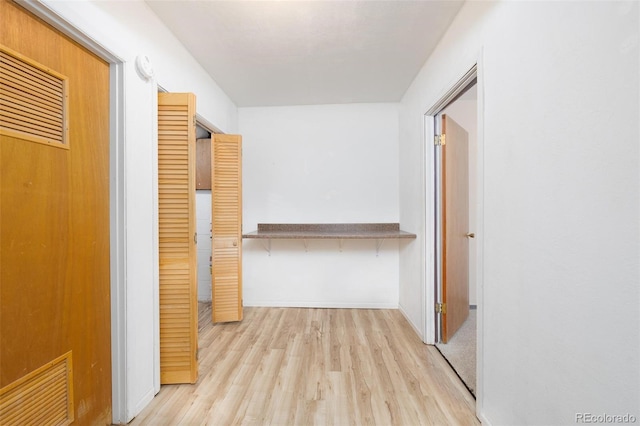 corridor featuring light wood-type flooring