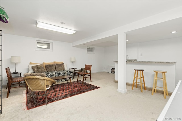 living room featuring light carpet