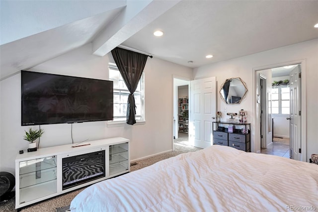 bedroom with recessed lighting, baseboards, carpet, and ensuite bath