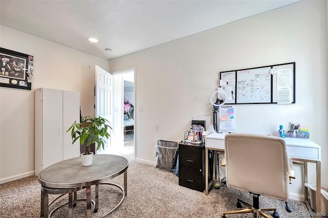 office space featuring carpet floors and baseboards